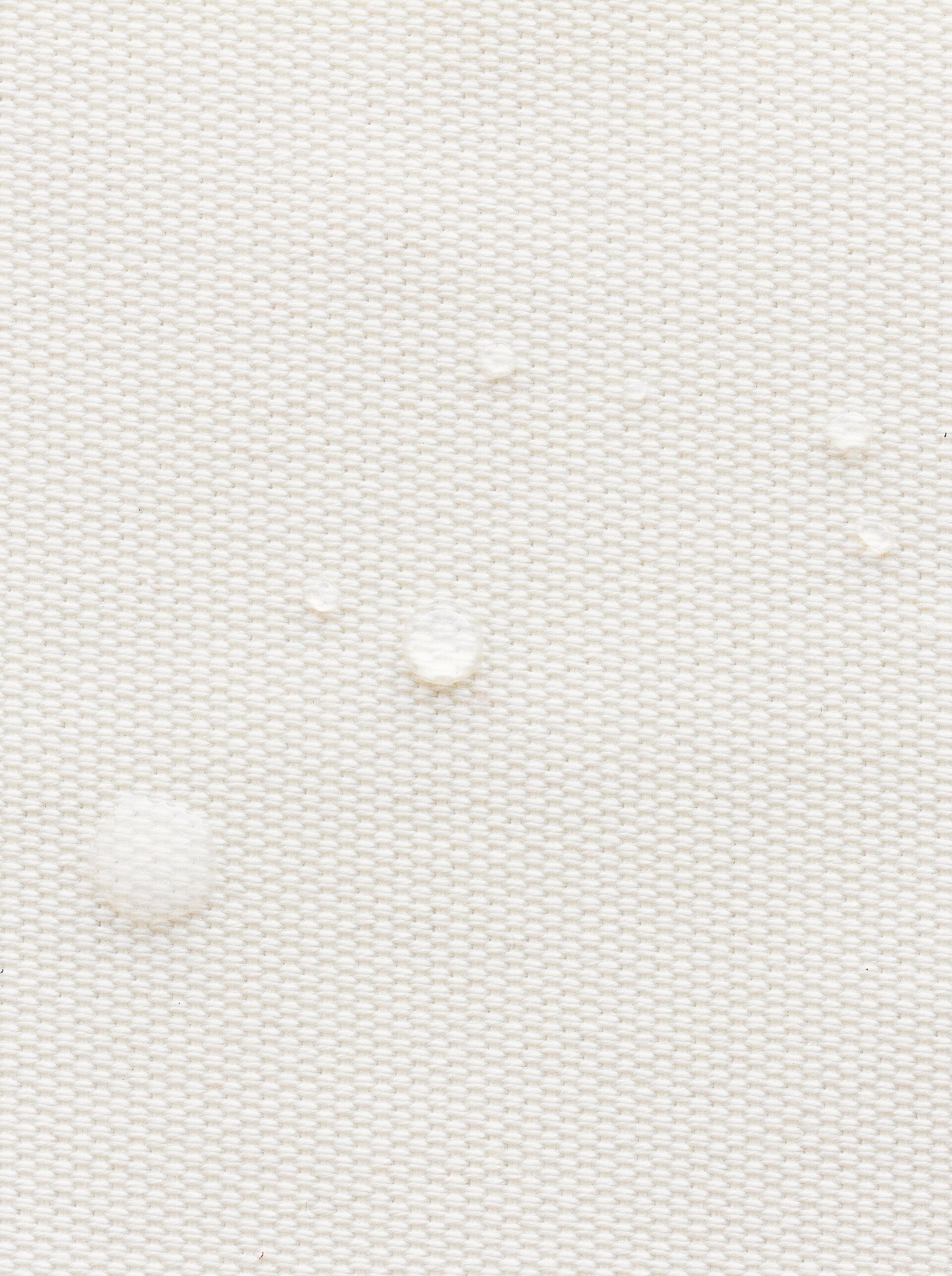 A roll of woven textile, close enough to see the weave.